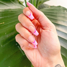 Load image into Gallery viewer, Coffin shaped press-on nails with a nude base with a crecent of hot pink under a light pink deep french manicure
